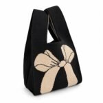 Bolso de mano negro con lazo beige